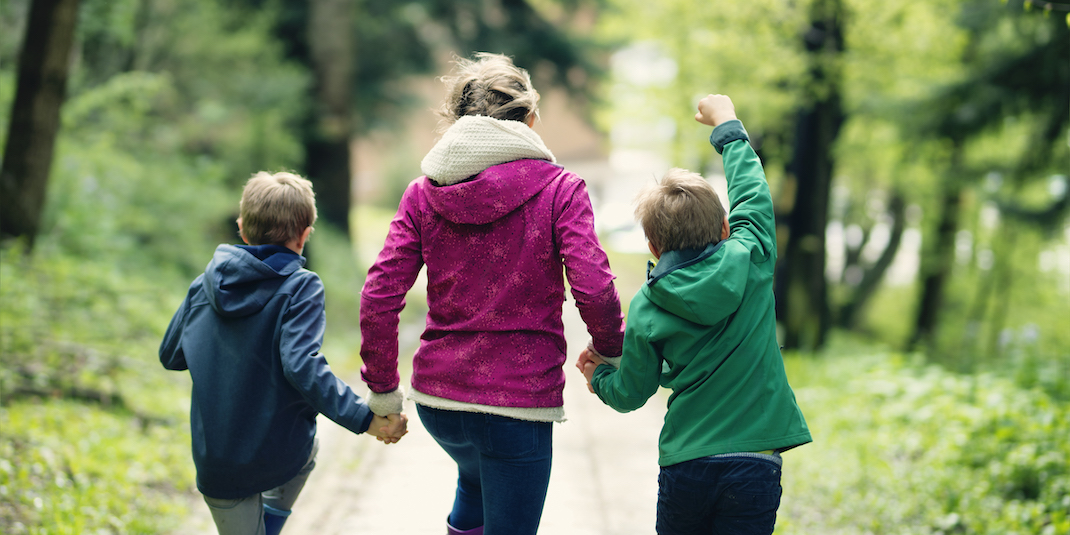 Family walking on trail